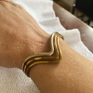 Elegant Gold and Copper Wave Bracelet